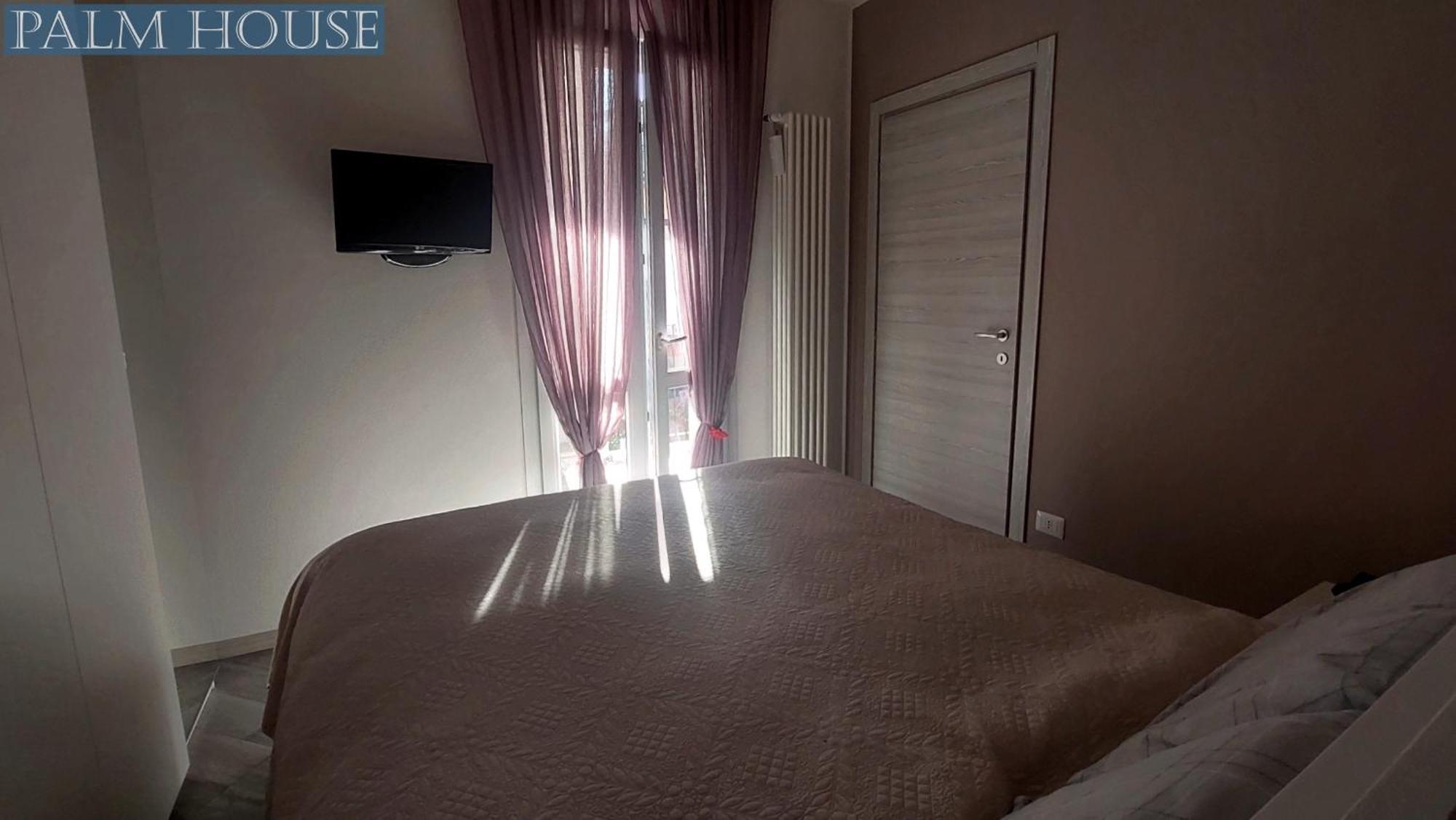 Palm House Apartment Brusimpiano Luaran gambar